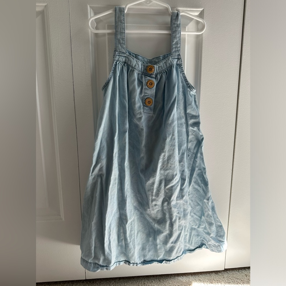 A sleeveless cotton jean light blue dress